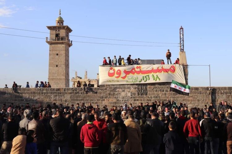 Protesters commemorate the 13th anniversary of the Syrian uprising in front of Daraa city’s Al-Omari Mosque. (Source: Telegram)