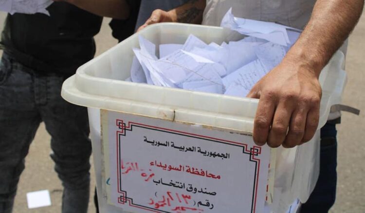Protesters seized and destroyed ballot boxes in several polling stations across Suwayda. (Photo: Suwayda24)