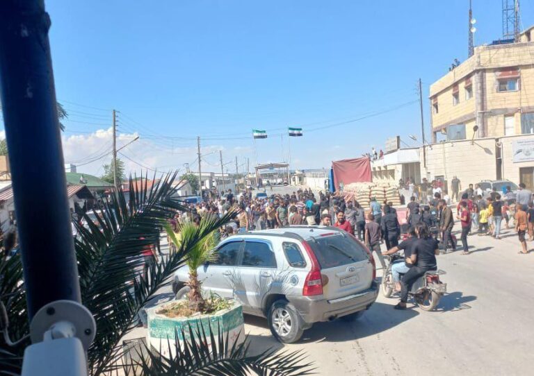 Protesters in north-west Syria block the Bab al-Salameh crossing with Turkey. (Photo: Telegram)