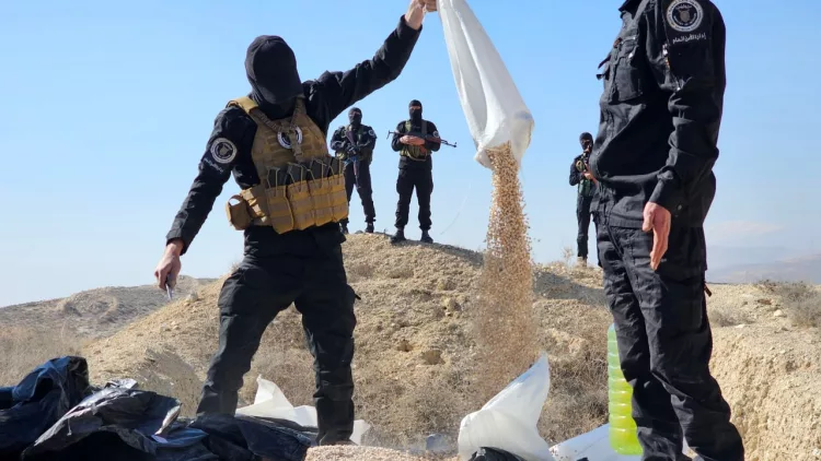 Narcotics officers under Syria’s interim Ministry of Interior destroy Captagon pills seized during a raid of the 4th Division’s headquarters. (Photo: Levant 24)